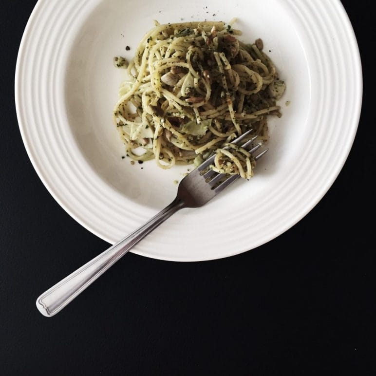 Plate of pesto with a fork.