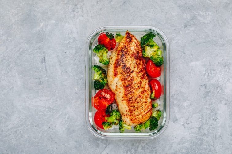 Grilled chicken in a meal prep container.