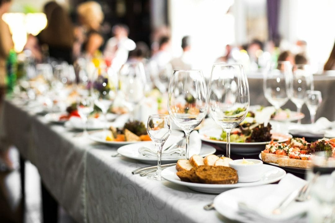 tablet set with sparkling glassware for dinner party